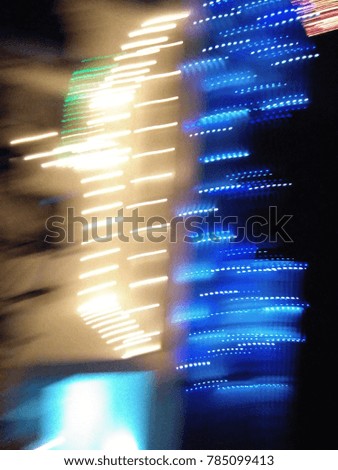 Multicolor Abstract City lights in motion. Good for Christmas and New Year celebrations. Abstract background of Blue, Green, Red, Yellow and white. 