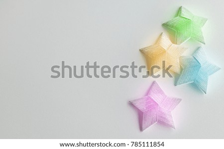 Multi-color Christmas star isolated on white background with copy space and soft focus