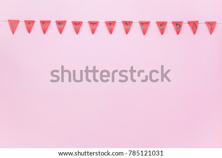 Table top view aerial image of Valentine 's day background concept.Valentines flag or Party banner on modern rustic pink wallpaper at home office desk studio.free space for creative design mock up.