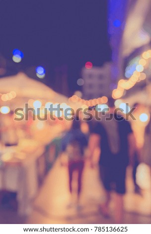 Abstract Blurred image of Night Festival on street  with light bokeh for background usage. (vintage tone)