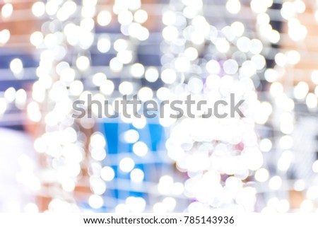 Colorful white , purple and violet Christmas. Bokeh background of de focused glittering lights, Christmas background pattern concept.