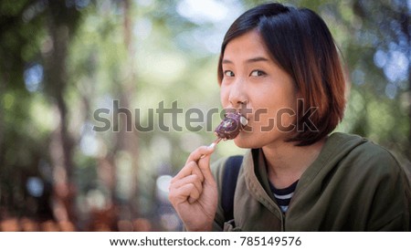 Happy woman eating ice cream.