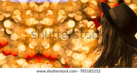 Celebration concept - Merry Christmas and happy New Year - Portrait of an attractive obese woman outdoor - night bokeh lights background