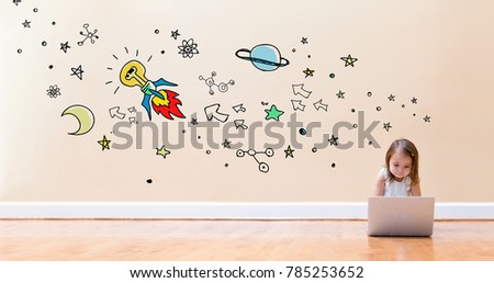 Idear Rocket with little girl using a laptop computer on floor