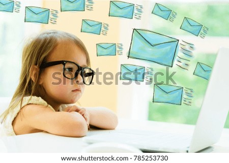 Emails with little girl using her laptop