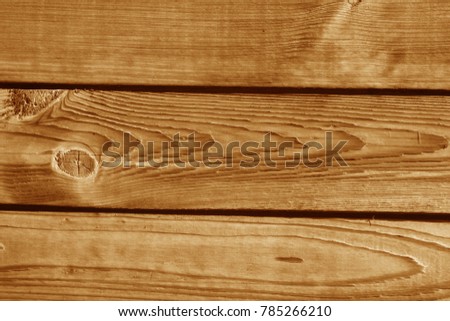 Wooden wall texture in orange tone. Abstract background and texture for design.