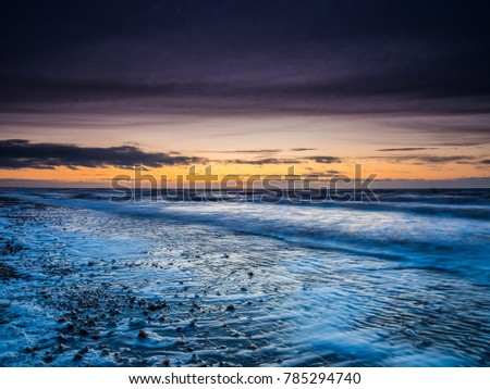 Sunset on Hunstanton beach in Norfolk England long exposure photography
