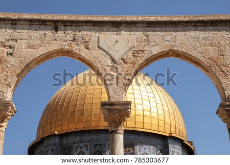 Horizontal picture of the arches with clock in front of the Dome of the Rock, important landmark of Israel, located inside the walls of Old Jerusalem