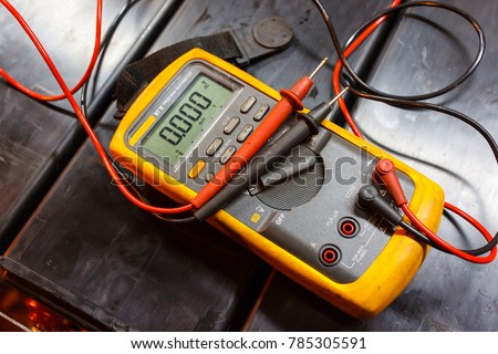 Yellow Multimeter, A multimeter or a multitester is an electronic measuring instrument. A typical multimeter can measure voltage, current, and resistance. Royalty-Free Stock Photo #785305591