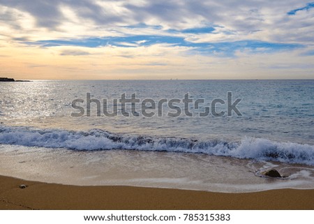 Landscape; The beach, the Mediterranean sea, waves, sky with beautiful clouds.