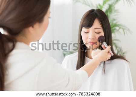 attractive asian woman in hair salon