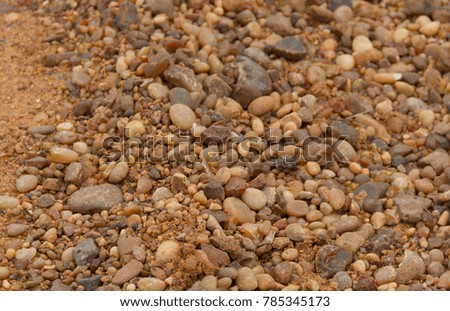 textured background of stones and river sand