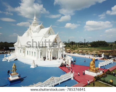 The big white church Beautiful.Wat Hin Thaen Lamphachi is located in the middle of the field at Kanchanaburi, Thailand. Website background / banner background