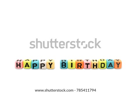 Close up image of the alphabet dice or letter blocks of a word HAPPY BIRTHDAY, isolated on white background with embed clipping path and copy-space provided.