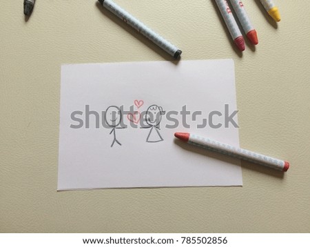Drawing couple with hearts by crayons
