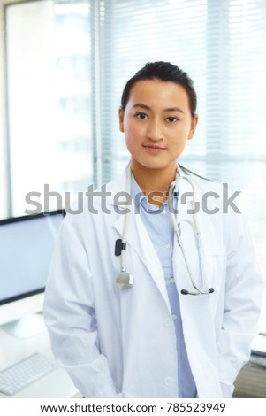 portrait of young asian doctor indoor
