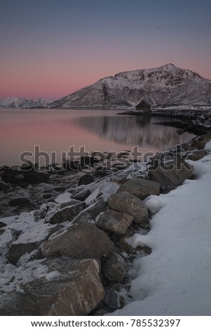 Sunset at Fjord camp site with background view in Lofoten,Norway