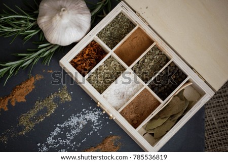 garlic and spices on a wooden table\ warm sunlight kitchen