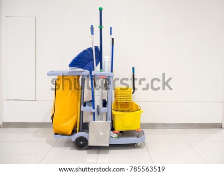 Cleaning tools cart wait for cleaning.Bucket and set of cleaning equipment in the office and Department store. cleaning service concept Royalty-Free Stock Photo #785563519