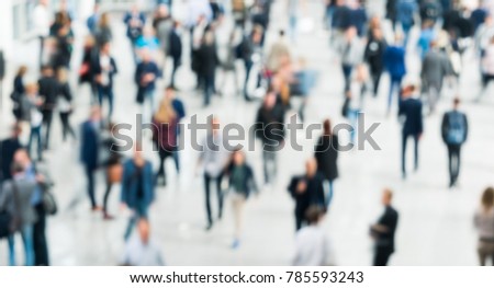 Blurred people at a trade fair