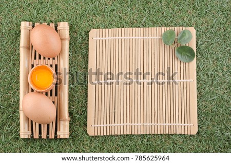 egg and bamboo grilles lay on the lawn.