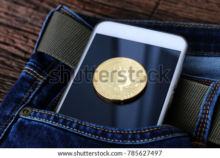 Electronic money Bitcoin gold coin on Smartphone