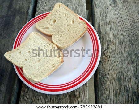 2 slices of plain white bread on a plate
