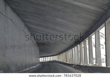 Structure covering mountain road 