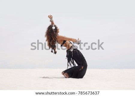 tribal woman belly dancer outdoors Royalty-Free Stock Photo #785673637