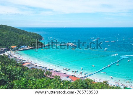 High view of the beautiful beach with tourists and harbor.Koh Larn Pattaya Thailand