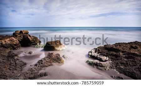 Landscape of a small beach with rocks