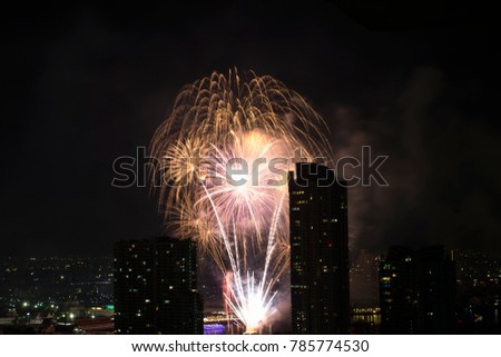 Fireworks shoot from boat on Chaopraya river in Bangkok on New Year festival.