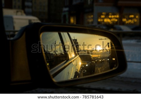Rear View Mirror Reflection on sun down