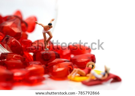 miniature people : wearing swimsuit relaxing with red heart,lover concept