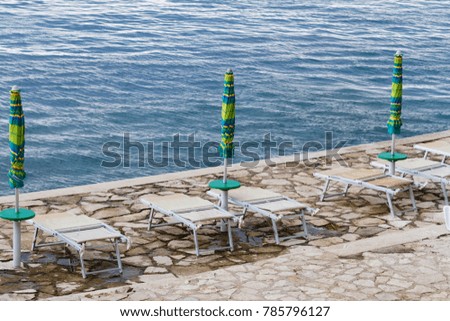 Striped beach umbrella on the beach - Croatia