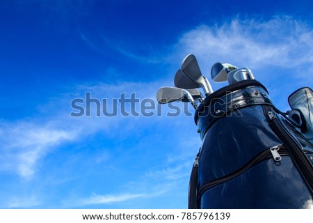 Golf club in bag with blue sky background. Royalty-Free Stock Photo #785796139