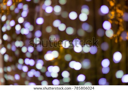 silver and white bokeh from lights burb defocused. abstract background