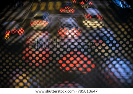 Colorful abstract bokeh with blurry background of vehicles on the street