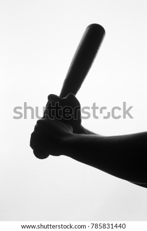 Silhouette of baseball bat in hands