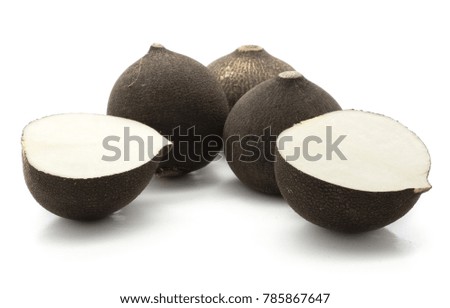 Black radish three bulbs and two halves isolated on white background
