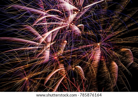Firework display in night sky for countdown to new year