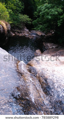Rocks and small waterfall in Sri Lanka.