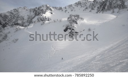 Innsbruck, Europe. Mountain skiing. A sunny day, low clouds over the mountains.