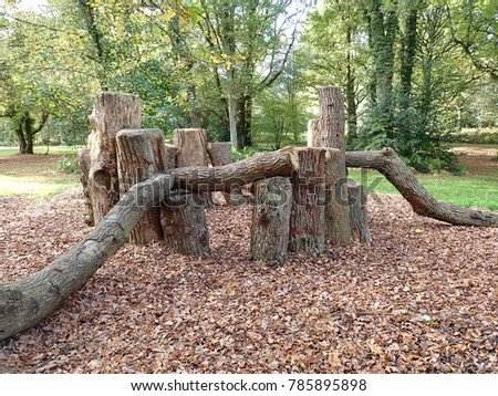 Natural play area constructed with sustainably felled oak tree trunks on Chorleywood Common in Hertfordshire, UK Royalty-Free Stock Photo #785895898