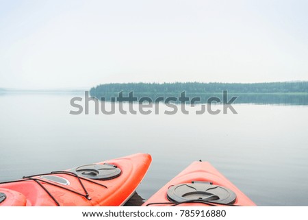 Two kayaks on the middle of beautiful calm lake, Alberta, Canada