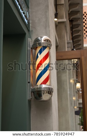 Three Striped Blue White Red Vintage Barber Pole Sign With Yellow Light Inside