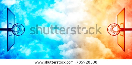 Basketball hoop on basketball court under dramatic sky with clouds