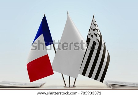 Flags of France and Brittany with a white flag in the middle