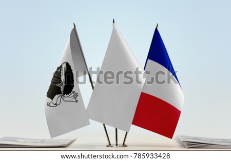 Flags of Corsica and France with a white flag in the middle