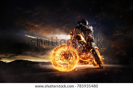 Dark motorbiker staying on burning motorcycle in sunset light. Dark art wallpaper photo of chopper motorbike. Very high resolution image